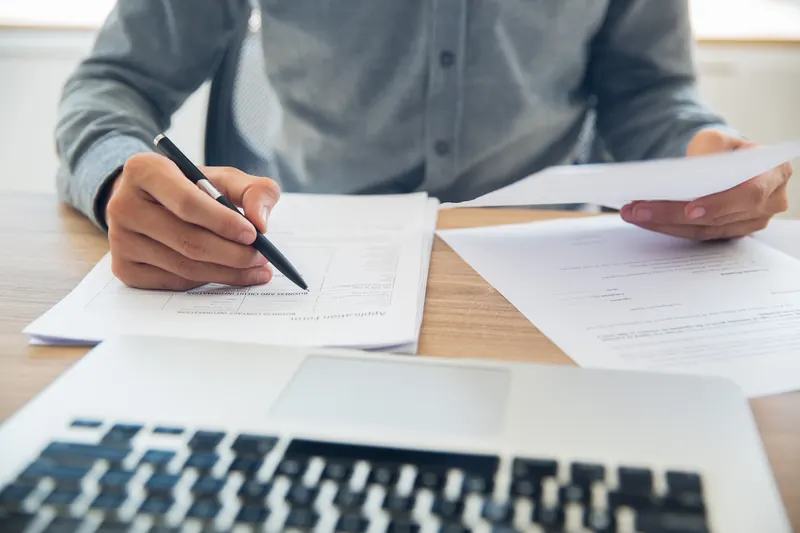 Checking a company document at the desk