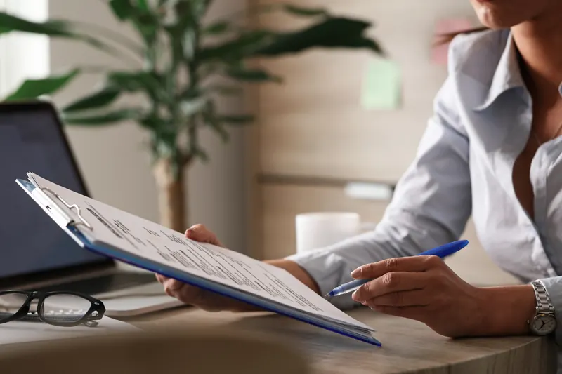 A professional reviewing a company report